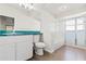 Bathroom with teal vanity, tub, and shower at 9131 Haas Dr, Hudson, FL 34669