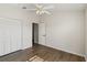 Bedroom with wood-look floors and double doors at 9131 Haas Dr, Hudson, FL 34669