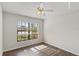 Bedroom with wood-look floors and large window at 9131 Haas Dr, Hudson, FL 34669