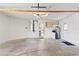Spacious garage with concrete flooring and ceiling fan at 9131 Haas Dr, Hudson, FL 34669