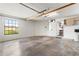 Spacious garage with overhead storage and window at 9131 Haas Dr, Hudson, FL 34669