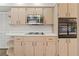 Kitchen with stainless steel appliances and wood cabinets at 9131 Haas Dr, Hudson, FL 34669