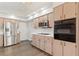 Kitchen with stainless steel appliances and wood cabinets at 9131 Haas Dr, Hudson, FL 34669