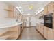 Kitchen with stainless steel appliances and wood cabinets at 9131 Haas Dr, Hudson, FL 34669