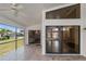 Spacious screened patio with tile flooring and ceiling fan at 9131 Haas Dr, Hudson, FL 34669