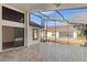 Large screened patio with view of backyard at 9131 Haas Dr, Hudson, FL 34669