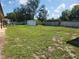 Large grassy backyard with shed and fence at 6075 Shingler Ave, Spring Hill, FL 34608