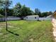 Spacious backyard with shed and trees at 6075 Shingler Ave, Spring Hill, FL 34608