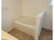 Bathroom featuring an oval bathtub and tiled floor at 6075 Shingler Ave, Spring Hill, FL 34608