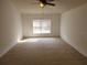 Spacious bedroom with carpeted floor and large window at 6075 Shingler Ave, Spring Hill, FL 34608