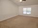 Large bedroom with neutral walls and carpet flooring at 6075 Shingler Ave, Spring Hill, FL 34608