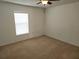 Bright bedroom with carpeted floor and window at 6075 Shingler Ave, Spring Hill, FL 34608