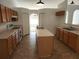 Open kitchen with island and double sinks at 6075 Shingler Ave, Spring Hill, FL 34608