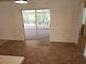 Eat-in kitchen with sliding glass doors to screened porch at 6075 Shingler Ave, Spring Hill, FL 34608