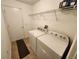 Laundry room with washer, dryer, and shelving at 6075 Shingler Ave, Spring Hill, FL 34608