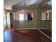 Open dining area with hardwood floors and kitchen view at 5265 E Bay Dr # 420, Clearwater, FL 33764