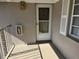 Inviting condo entrance with a white door and balcony at 5265 E Bay Dr # 420, Clearwater, FL 33764