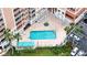 Aerial view of the building, pool, and parking at 4516 Seagull Dr # 414, New Port Richey, FL 34652