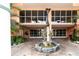 Elegant dolphin fountain at the building entrance at 4516 Seagull Dr # 414, New Port Richey, FL 34652