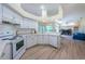 White kitchen with ample counter space and modern appliances at 8233 Danubian Pl, Trinity, FL 34655