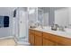 Double vanity bathroom with a large walk-in shower at 11724 Heritage Point Dr, Hudson, FL 34667
