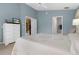 Spacious bedroom with views of the living area and access to a bathroom at 11724 Heritage Point Dr, Hudson, FL 34667
