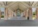 Brick columns and a covered entryway to the community clubhouse at 11724 Heritage Point Dr, Hudson, FL 34667