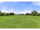 Scenic golf course view with lush green fairways at 11724 Heritage Point Dr, Hudson, FL 34667