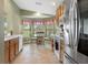 Well-equipped kitchen with stainless steel appliances and breakfast nook at 11724 Heritage Point Dr, Hudson, FL 34667