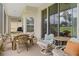Relaxing screened porch with patio furniture and grill at 11724 Heritage Point Dr, Hudson, FL 34667