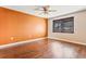 Spacious bedroom with wood-look floors and an accent wall at 6316 Spoonbill Dr, New Port Richey, FL 34652