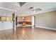 Bright dining room with wood flooring and a pass-through to the kitchen at 6316 Spoonbill Dr, New Port Richey, FL 34652