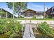 Wooden walkway to private dock on calm waters at 6316 Spoonbill Dr, New Port Richey, FL 34652