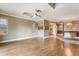 Spacious living room featuring light walls and wood-look flooring at 6316 Spoonbill Dr, New Port Richey, FL 34652
