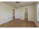 Bedroom showcasing laminate floors with access to the bathroom at 7712 Hillside Ct # 202, Hudson, FL 34667