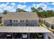 A well-maintained two-story condo building with designated covered parking at 7712 Hillside Ct # 202, Hudson, FL 34667