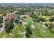 Aerial view of community amenities including tennis courts, pool, and clubhouse at 12205 Darwood Dr, Hudson, FL 34667