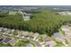 Community overview featuring houses, pond, and lush trees at 1153 Dustan Pl, Trinity, FL 34655