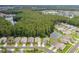 Aerial view of houses and a lake at 1153 Dustan Pl, Trinity, FL 34655
