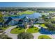 Aerial view of community clubhouse near golf course and lake at 1153 Dustan Pl, Trinity, FL 34655