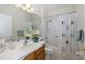 Clean bathroom with tub shower, single sink vanity and decorative shower curtain at 1153 Dustan Pl, Trinity, FL 34655