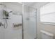 Clean bathroom with shower stall, toilet and single sink vanity at 1153 Dustan Pl, Trinity, FL 34655