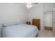 Bright bedroom with double bed, dresser, and ceiling fan at 1153 Dustan Pl, Trinity, FL 34655