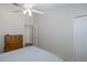 Spacious bedroom with dresser and ceiling fan at 1153 Dustan Pl, Trinity, FL 34655