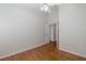 Simple bedroom with wood flooring, ceiling fan and double door closet at 1153 Dustan Pl, Trinity, FL 34655