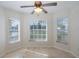 Breakfast nook with hardwood floors and three windows at 1153 Dustan Pl, Trinity, FL 34655