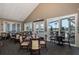 Bright dining room with tables and chairs near windows at 1153 Dustan Pl, Trinity, FL 34655
