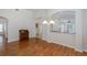 Dining area with hardwood floors and a wooden cabinet at 1153 Dustan Pl, Trinity, FL 34655
