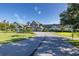 Community clubhouse with circular driveway and landscaping at 1153 Dustan Pl, Trinity, FL 34655