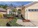 Front entrance with a landscaped walkway leading to the house at 1153 Dustan Pl, Trinity, FL 34655